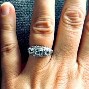 0.82CTW AQUAMARINE AND 0.07CTW WHITE ZIRCON RHODIUM OVER STERLING SILVER RING